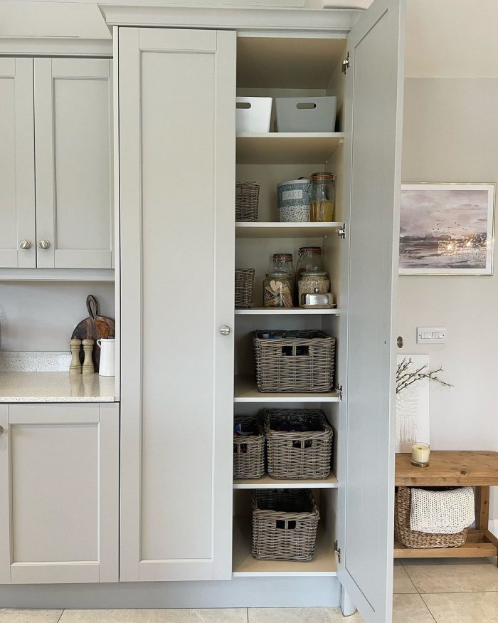 Grey and buff rattan cupboard storage baskets