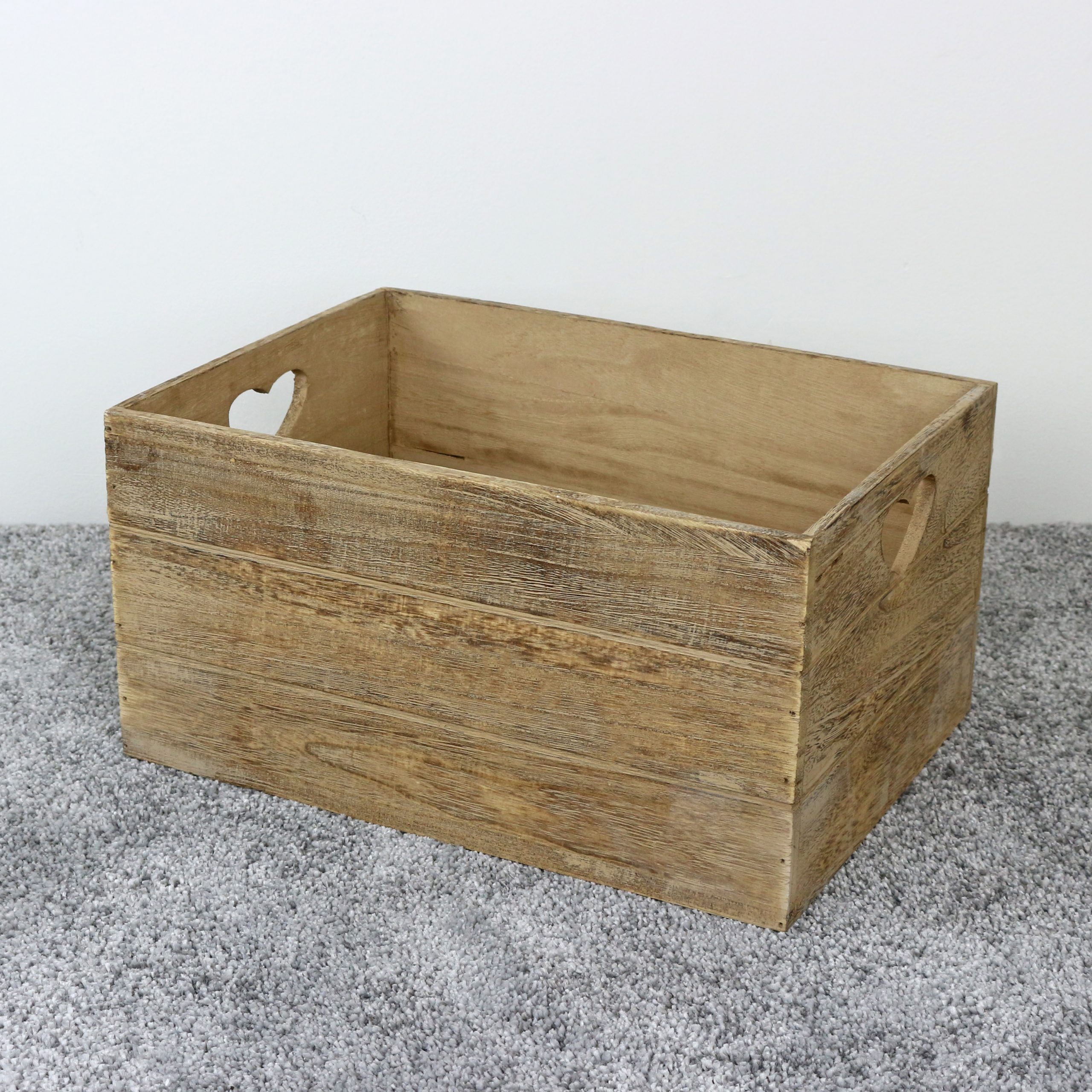 Rustic wooden crate-style basket with heart-shaped cut-out handles, ideal for building bespoke hampers.