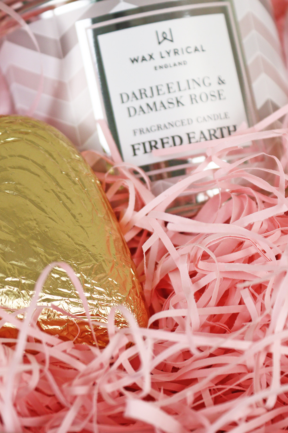 pink shred in a hamper basket with gifts for Mother's Day