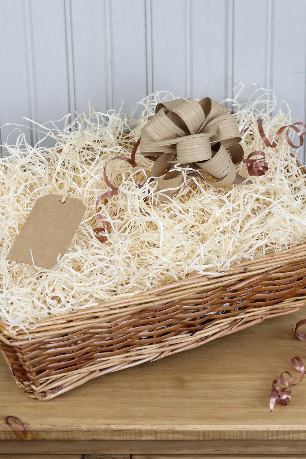 a beautiful rustic gift hamper with kraft bow and tag.