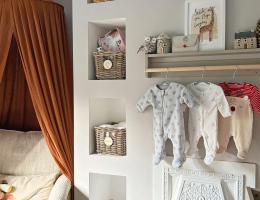an organised and stylish baby nursery with wicker storage baskets