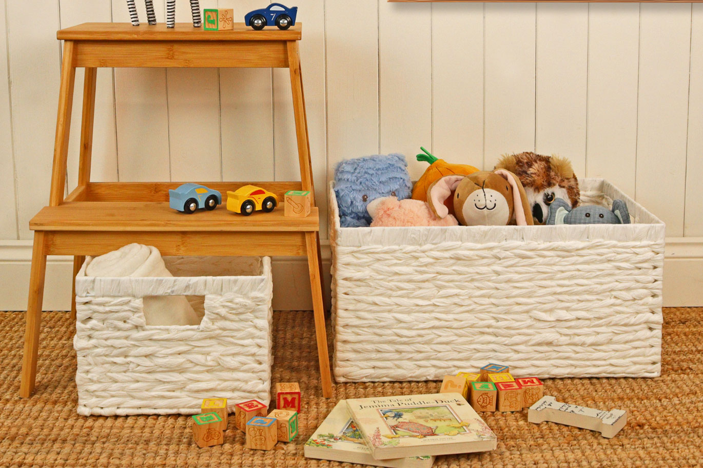 White woven storage basket beside a children’s shelf, ideal for soft toys and books while keeping play areas organised.
